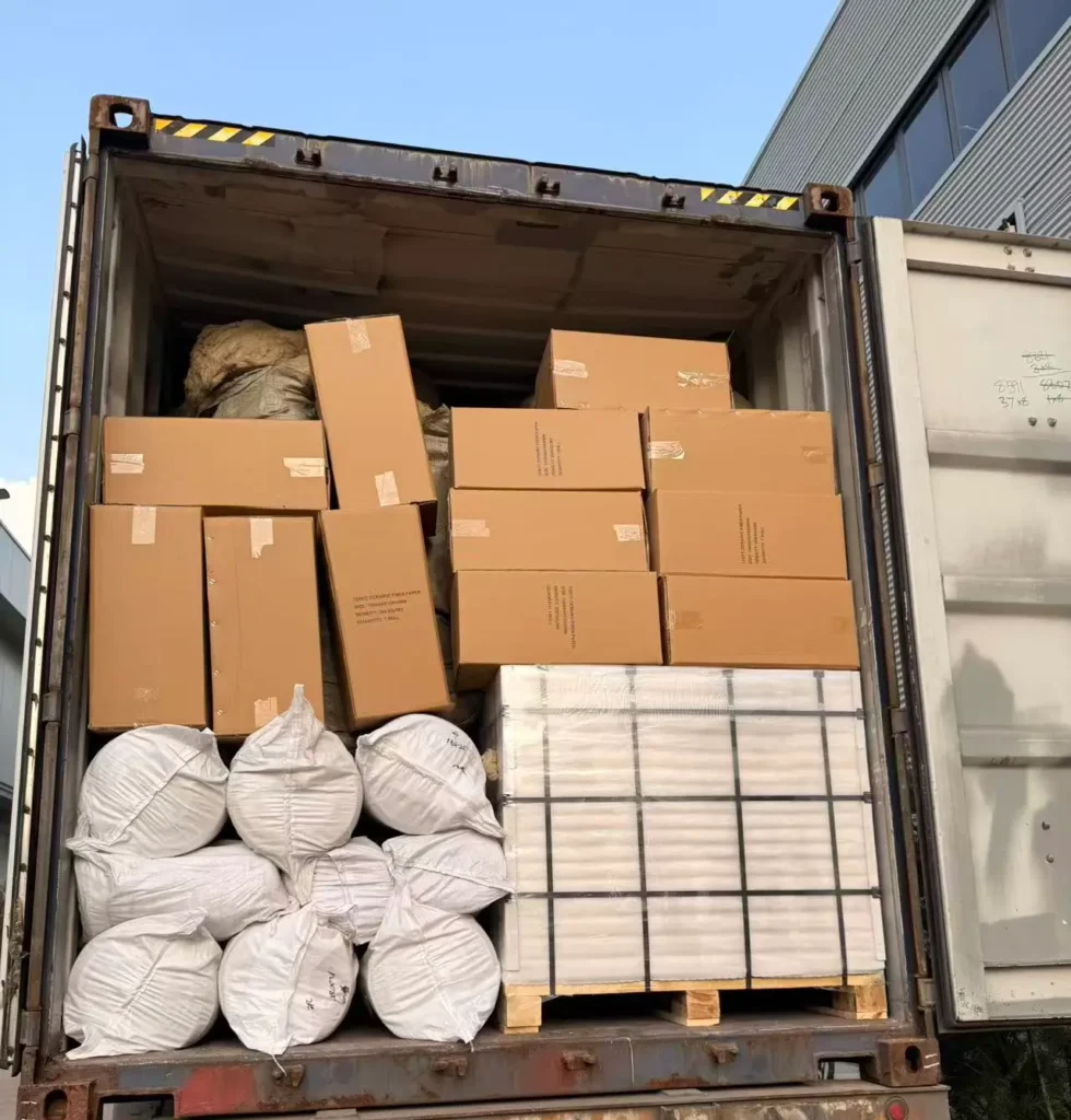 12.3 tons of multi-category ceramic fiber products, including boards, paper, and blankets, loaded into a shipping container.